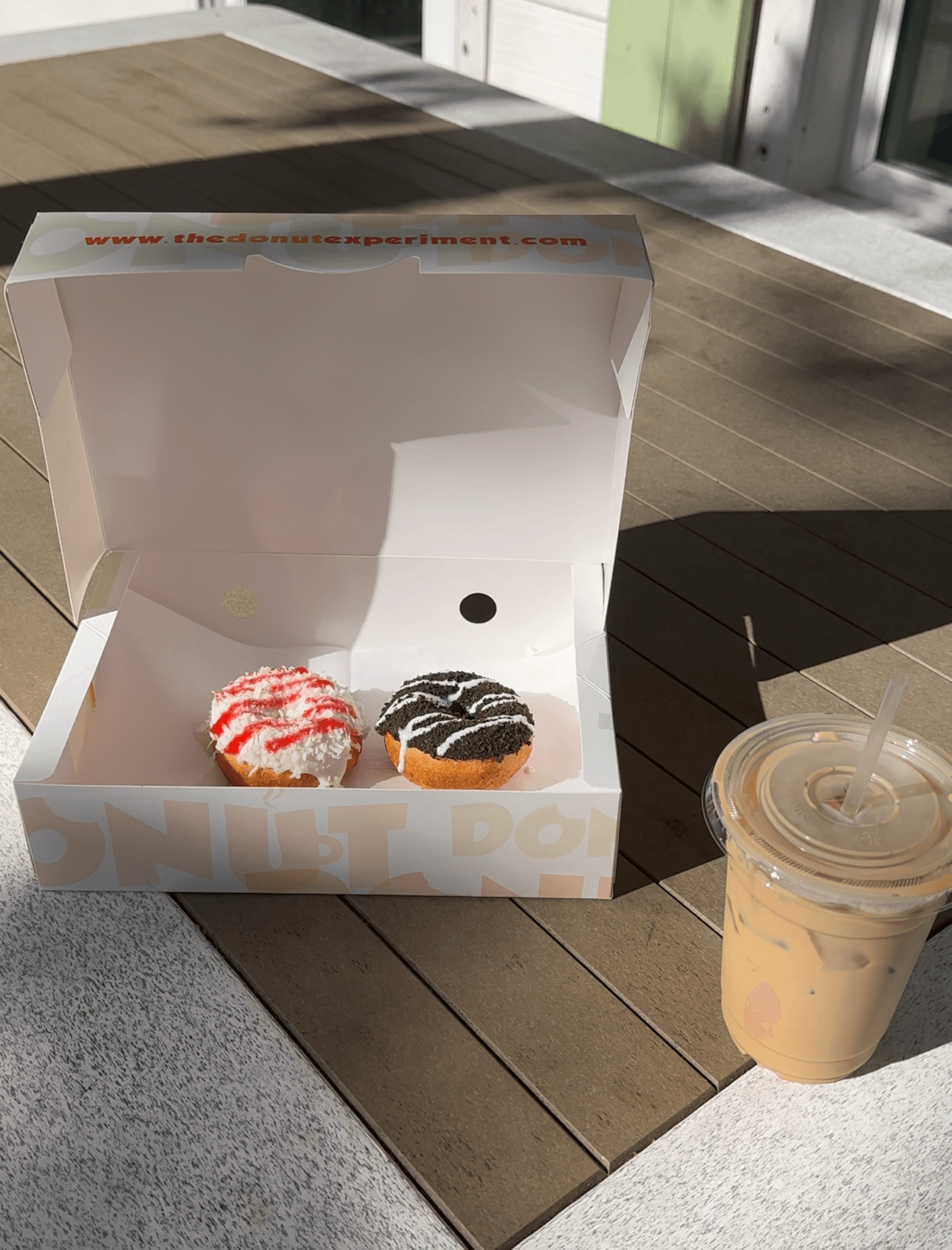 two donuts and coffee from The Donut Experiment